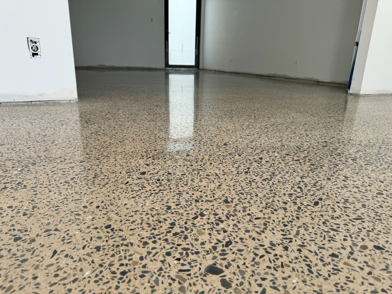 Polished epoxy flake flooring installed by Total Epoxy Solutions